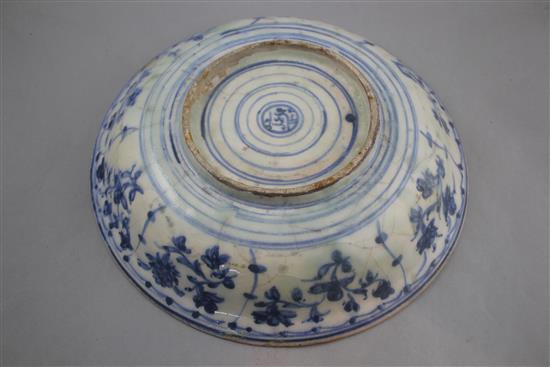 A Persian blue and white dish, Safavid, 17th century, 35cm, rim chips, restored